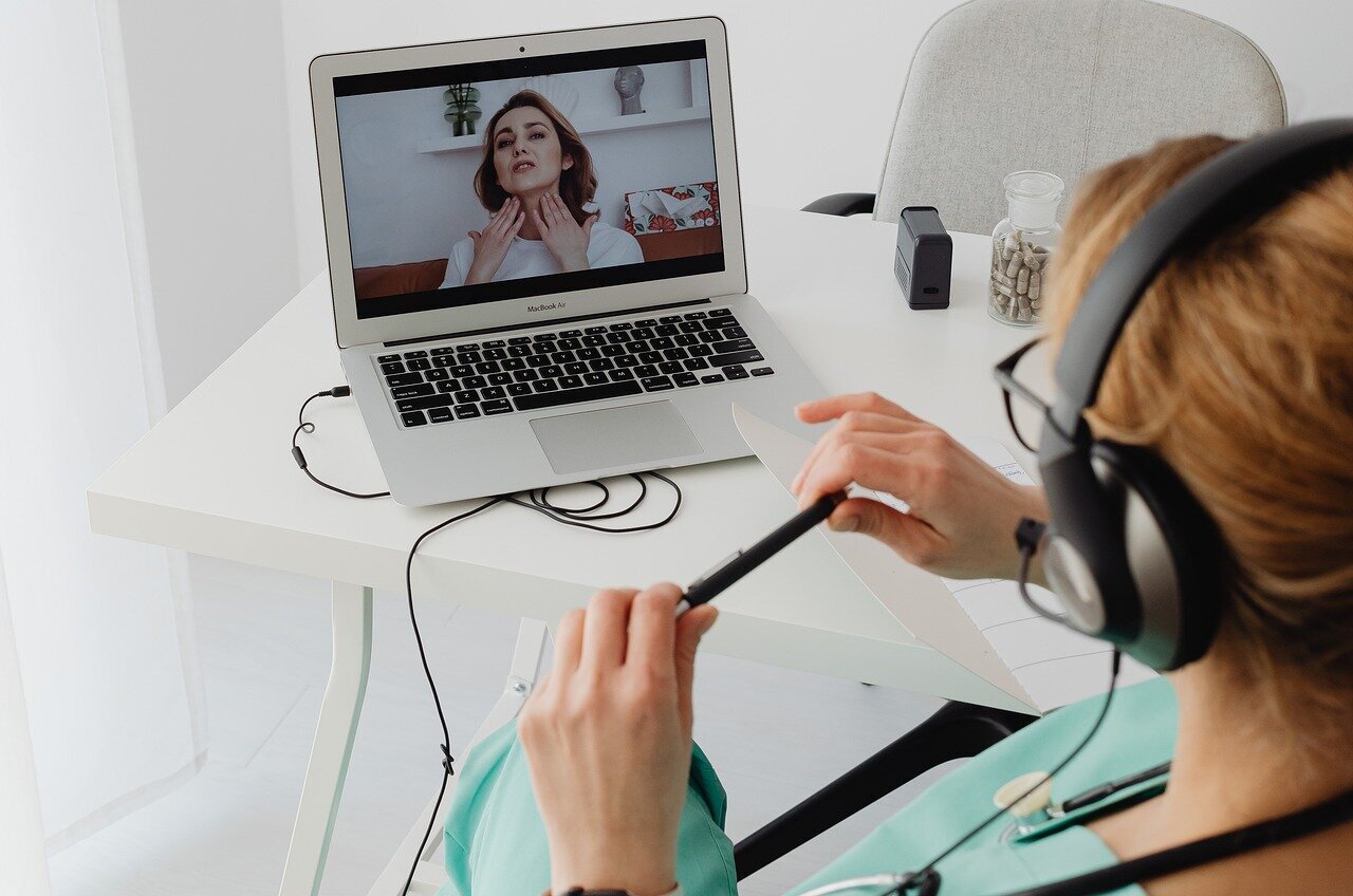 A patient speaking with a provider during a telehealth appointment